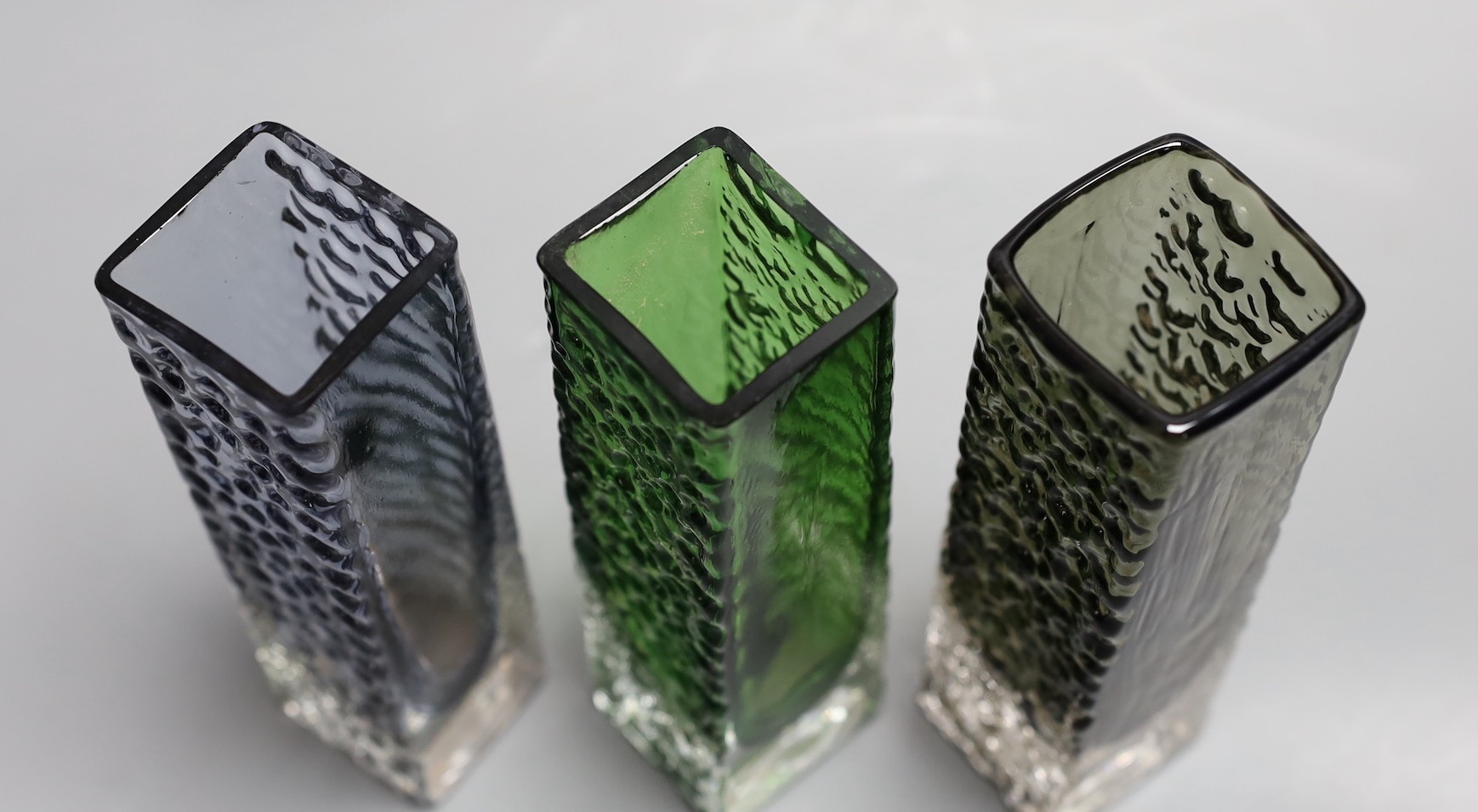 A trio of Whitefriars 'Nailhead' vases, model 9683, designed by Geoffrey Baxter, various colours, 17cm high.